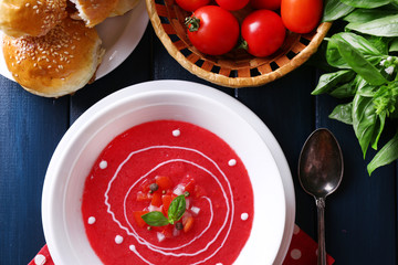 Gazpacho soup on color wooden background