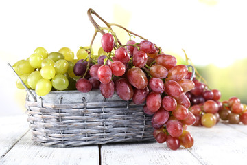 Bunches of ripe grape in wicker basket