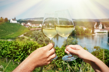 Pair of wineglasses against vineyards in Rheinau, Switzerland © HappyAlex