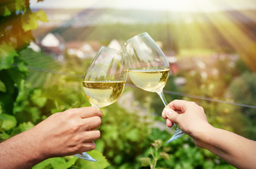 Pair of wineglasses against vineyards in Rheinau, Switzerland