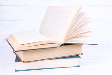 Books on light wooden background