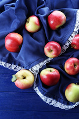 Juicy apples on wooden table, close-up