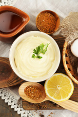 Mayonnaise ingredients on wooden background