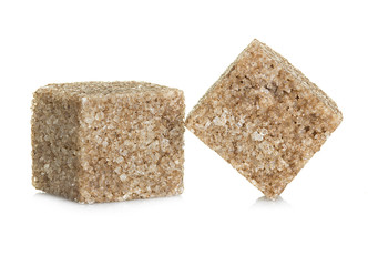 Brown sugar  cubes, isolated on white background