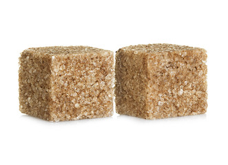 Brown sugar  cubes, isolated on white background