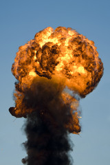 Large industrial fire with thick black smoke