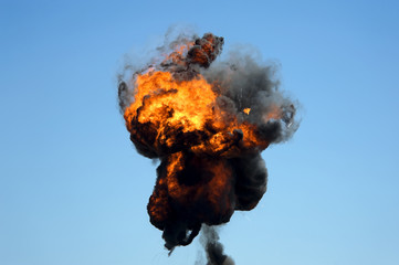 Large industrial fire with thick black smoke