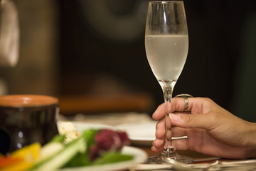 Hands of women with champagne glass
