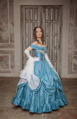 Fototapeta premium Beautiful woman in blue medieval dress