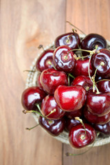 Fresh red Cherries on wooden table