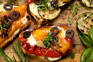 Bruschetta with grilled bell pepper, zucchini and  cheese