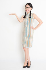 Asian Chinese girl palm holding something