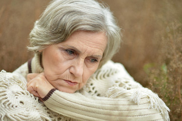 Pensive elderly woman