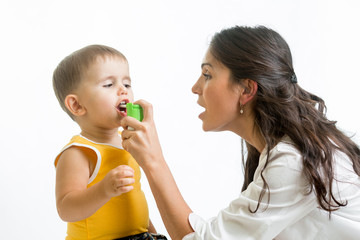 doctor giving medical spray  to kid