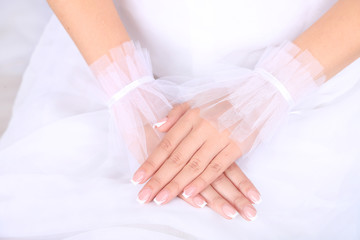 Wedding gloves on  hands of bride, close-up