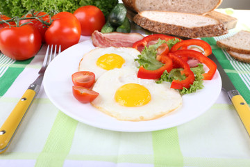 Scrambled eggs with bacon and vegetables served