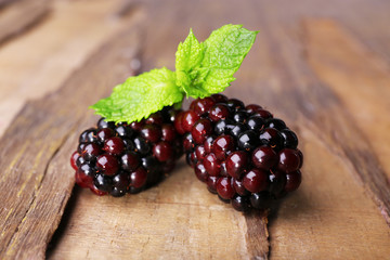 Blackberries on wooden background closeup