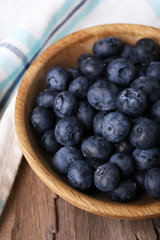Wooden bowl of blueberries