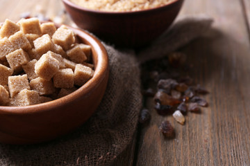 Brown sugar cubes, reed and crystal sugar in bowl