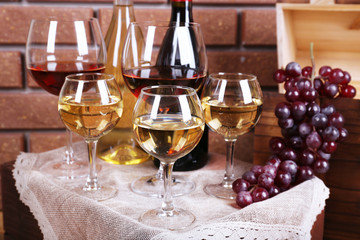 Bottles and glasses of wine and ripe grapes