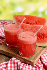 Juicy watermelon on table on bright background
