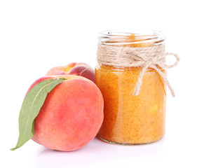 tasty peach jam with fresh peaches, isolated on white