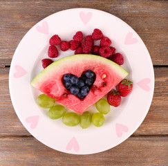 Fresh juicy watermelon slice  with cut out heart shape, filled