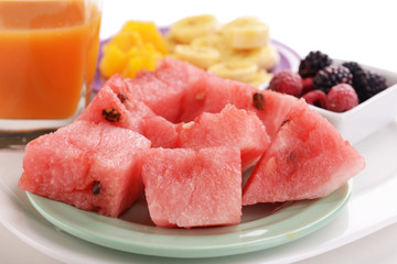 Slices of fruits with berries