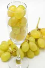 Fresh green grapes in glass for new year celebration
