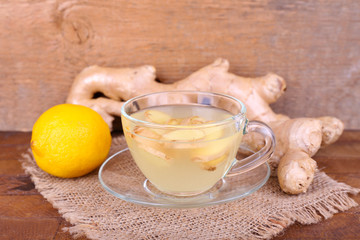 Cup of ginger drink and lemon
