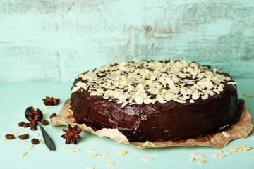 Tasty chocolate cake with almond, on old wooden table