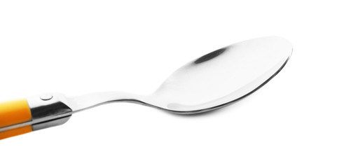 Metal spoon with yellow handle isolated on white