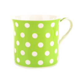 Polka dot mug isolated on white © Africa Studio