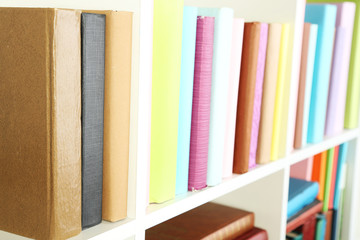 Hand picking book in library