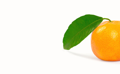 Tangerine with green leaves isolated on white