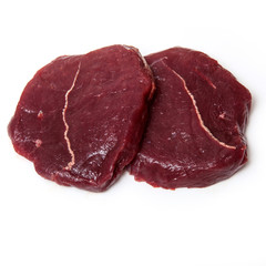 Zebra steaks isolated on a white studio background,