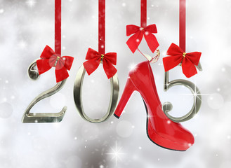 High heel shoe and 2015 number hanging on red ribbons