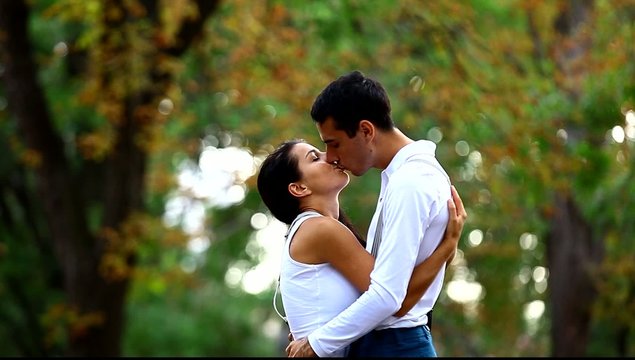 Couple hugging in the park.