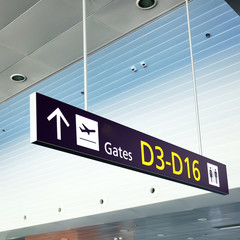 Gate A, B. Sign in airport. Interior of the airport.