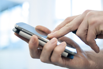 businessman hand holding mobile phone