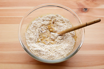 Flour being stirred into batter for banana bread