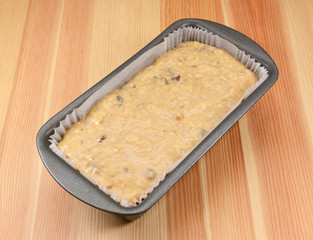 Banana bread batter in a loaf tin