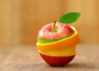 mixed fruit on wooden background.