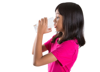 Young Asian preteen with a glass of water over white background