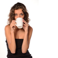 Young woman with cup of coffee on white isolated background