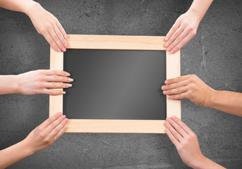 Hands holding frame