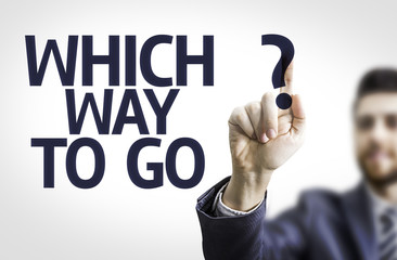 Business man pointing the text: Which Way to Go?