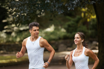 Running Couple. Young couple running in the summer park