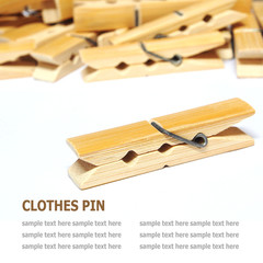 Wooden clothes pin isolated on white background
