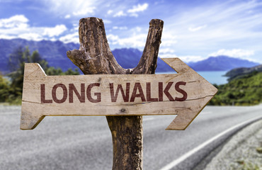 Longs Walks wooden sign with a landscape background